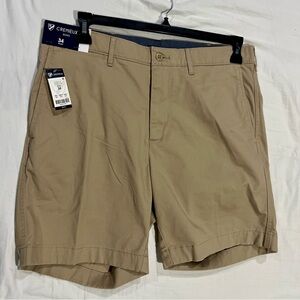 Tan and cream shorts with a casual, preppy vibe 7" inseam